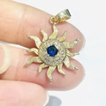 Gold sunflower pendant with blue gemstone and 925 silver hallmark detail - Gold Blue Gem Sun