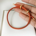 Adjustable red-brown braided leather rope bracelet with gold-plated metal hardware - Orange