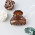 Matte brown semi-circular mini hair claw clip for high ponytail styling on grey background - Jelly Brown