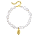 Elegant baroque pearl bracelet with gold cowrie shell pendant and adjustable clasp - Gold + Crab Claw