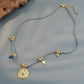 Bohemian colorful woven necklace with gold celestial charms and an eye pendant - Evil Eye Woven Rope