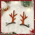 Pair of brown velvet reindeer antler hair clips on festive snow-covered background - Simple Brown Antler Pair