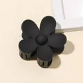 Close-up of matte black five-petal flower hair claw clip with professional grip teeth - Matte Flower Hair Clip - Black