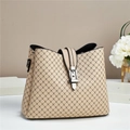 Detail of beige quilted bucket bag showing fine silver buckle and grid pattern finish - Patterned Khaki