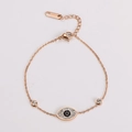 Macro detail of rose gold stainless steel evil eye bracelet with sparkling zircons - Rose Gold