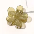 Detailed top view of a yellow translucent flower hair claw clip with a metal spring - Jelly Flower Hair Clip - Olive Green