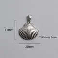 Detail view of a silver scallop shell pendant with dimensions 21mm by 20mm and 5mm thickness - Radiant Scallop Pendant (P00091S)
