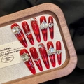 Detail of luxury handmade stiletto nails with red cat eye effect and crystal diamonds - XS / Cat Eye Red 3D Rhinestone Style