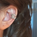 Detailed view of silver ear cuff with double C logo and micro-set sparkling zircons - Interlocking Letter Ear Cuff (Single) / Silver