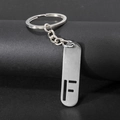 Polished stainless steel keychain featuring a modern hollow letter F pendant charm - Letter F