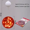 Hanging LED snowman Christmas light with warm yellow glow and Merry Christmas disc - Christmas Together / Warm White
