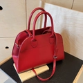 Chic burgundy leather tote bag with adjustable shoulder strap on vintage book background - Small (Smooth Surface) / Red