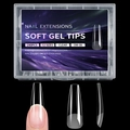 Detailed view of 240 clear soft gel nail extensions in a box with 12 various sizes - Round Style (OM-06)