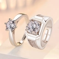 Macro shot of silver couple rings with round gemstones and adjustable open bands - Classic Cool