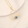 Detailed close-up of golden evil eye pendant with blue bead on white ceramic tray - Round Hollow Bead Style(8#)