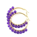 Macro detail of purple amethyst beads on gold wire wrapped hoop earrings for women - Gold + Amethyst