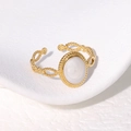 Vintage gold plated stainless steel twisted ring with white oval enamel detail - Pearl White