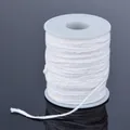 61m roll of 24-ply braided white cotton candle wick on a grey spool for DIY candle making - 61m