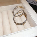 Detailed macro view of silver geometric C-shape hoop earrings with twisted metal texture - Silver Cross Hoop (34#)