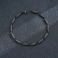 Close-up of matte black stainless steel chain bracelet with geometric links for men - Bamboo Link Chain / Black