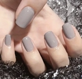 Detail of short square Morandi grey glossy press-on nails on silver sequin mesh background - Morandi Grey (CW266)