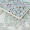 Macro detail of 10mm iridescent crackle glass beads in pastel gradient for DIY jewelry - Purple Green (10mm Protein Jade)