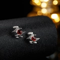 Macro shot of silver earrings with red oval gemstones on a black display stand - Silver Natural Garnet Stud Earrings