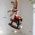 Resin elf on a rocking horse Christmas tree pendant, measures 8.5cm by 6cm, 50g weight - Elf on Rocking Horse