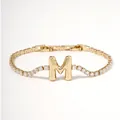 Elegant gold letter M bracelet with sparkling zircon stones and classic tennis chain - Letter M
