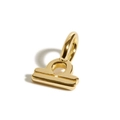 Macro detail of polished gold-plated Libra zodiac pendant with minimalist metal finish - Libra Zodiac Pendant