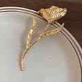 Elegant gold tulip brooch with textured petals and vintage finish on ceramic tray - Gold Tulip Shape