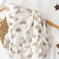 Soft muslin cotton baby swaddle blanket featuring a brown rainbow print on cream background - Beige Brown Rainbow