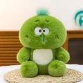 Funny green plush monster toy with blue runny nose on a woven mat in a soft room - Turtle / 22cm
