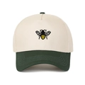 Detail of bee embroidery on a two-tone cotton baseball cap with ivory and dark green panels - Army Green