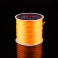 Strong orange crystal elastic cord on white spool for DIY jewelry bead stringing - Gold