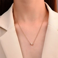Detail of a vintage gold heart pendant with radial texture on a delicate chain necklace - Gold (KC Gold A-639)