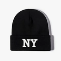 Detailed view of black knit beanie featuring thick texture and white NY embroidery - One Size / Black