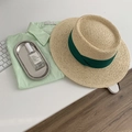Close-up of a woven straw sun hat with a green ribbon next to a light green cotton shirt - M (56-58cm) / Beige Fedora-Green Ribbon