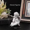 White resin thinking angel sculpture in sitting pose, size 11cm x 9.5cm - Resting Chin Angel Figurine