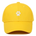 Detail view of white animal paw embroidery on yellow cotton twill baseball cap - Adjustable / Yellow