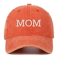 Macro detail of MOM embroidery on a vintage orange washed cotton baseball cap - MOM Embroidery / Orange