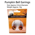 Halloween pumpkin bell earrings with orange metal cutout design on themed backing card - Pumpkin Bell Earrings