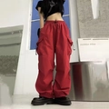 Women's red cargo pants with wide leg fit and multiple pockets in vibrant street style - S / Red