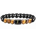 Detailed view of natural tiger eye and black agate beads with a golden letter F charm - Letter E