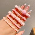 Pink elastic hair ties and scrunchies set for girls worn on hand with soft texture - Pink Series