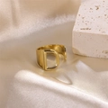 Elegant gold-finished stainless steel open ring featuring a hollow letter D design - Letter D / Gold