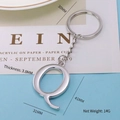 Polished silver metal letter Q keychain pendant with heavy duty split ring - Letter-Q