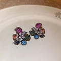 Detailed shot of flower-shaped earrings with colorful zircon on a ceramic tray - Five-Petal Colorful Zircon Flower Style / Silver Earring Post - Colorful
