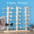 Three-row pine wood sunglasses display stand with 18 slots on a blue background - Triple Row 18 Pairs