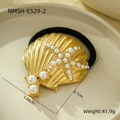 Detail view of 18k gold shell and starfish hair tie with dimensions 6.1cm x 5.08cm - Gold Shell Starfish Pearl Hair Tie
